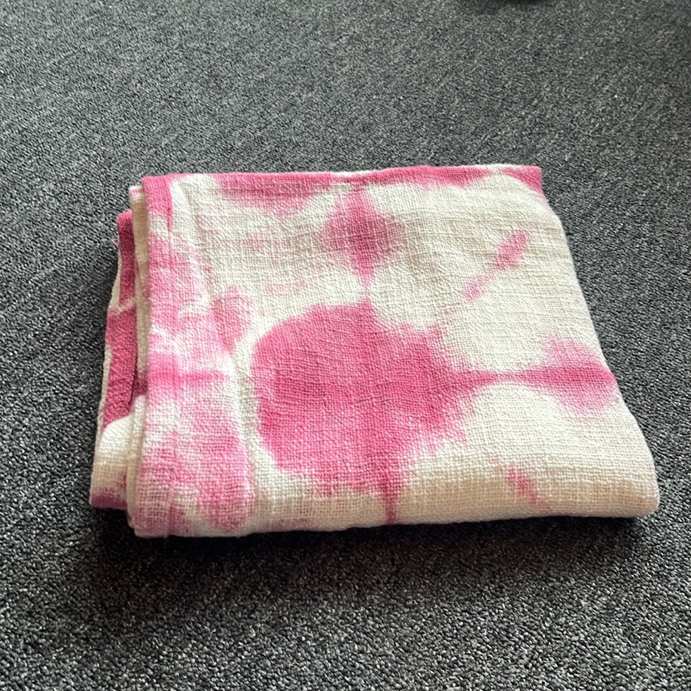 pink and white Dormify throw quilt blanket